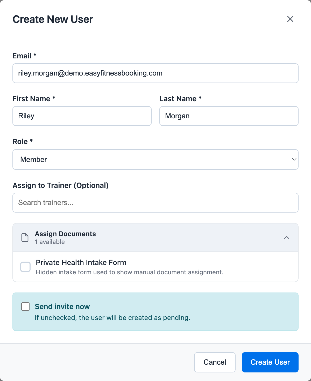 Create New User modal showing member email, first name, last name, role, optional trainer assignment, hidden document assignment, and send invite setting